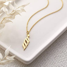 A silver necklace featuring a ready-made popular name in elegant Arabic calligraphy, crafted with artistic precision.

