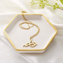 A silver necklace featuring a ready-made popular name in elegant Arabic calligraphy, crafted with artistic precision.

