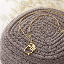 A silver necklace featuring a ready-made popular name in elegant Arabic calligraphy, crafted with artistic precision.

