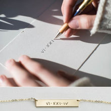 A Custom Handwriting Silver Necklace featuring a delicate engraving of handwriting on a sleek silver pendant with an elegant chain.

