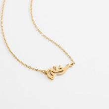 Sister Calligraphy Necklace in Silver featuring Arabic calligraphy, worn at 18 inches.

