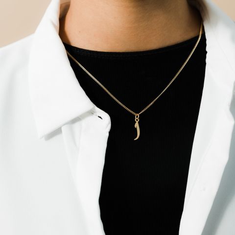 A silver curb chain necklace featuring a customizable hanging Arabic letter, worn at a 16-inch length.

