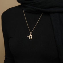 A silver necklace featuring a ready-made popular name in elegant Arabic calligraphy, crafted with artistic precision.

