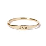 A dainty personalized signet ring in 18k gold-plated sterling silver, engraved with the initial 'S' and worn on a finger.