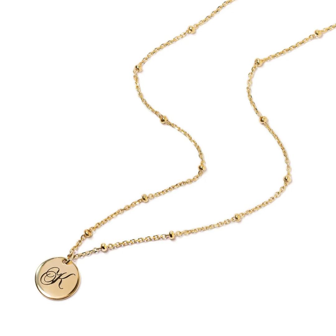 Dainty initial 'A' disc necklace with a satellite bead chain in 18k gold-plated sterling silver, shown against a neutral background.