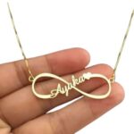 Personalized 'Emily' infinity name necklace in 18k gold-plated sterling silver, showing the name integrated into the timeless symbol.