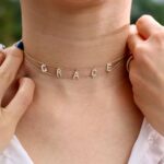 Gothic name choker with the name 'Aria' in Old English script, made from 18k gold-plated sterling silver.