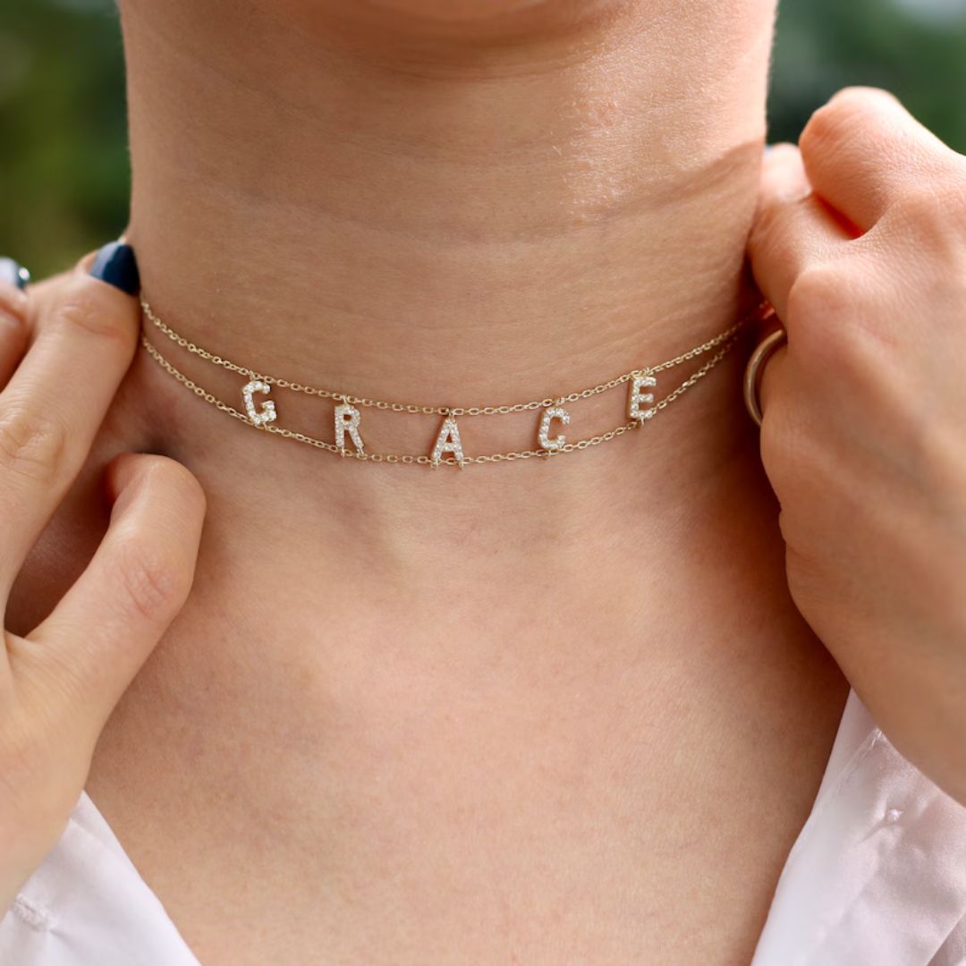 Gothic name choker with the name 'Aria' in Old English script, made from 18k gold-plated sterling silver.