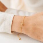 Dazzling pave initial 'A' bracelet in 18k gold-plated sterling silver, sparkling on a woman's wrist.