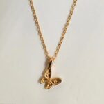 Graceful butterfly pendant necklace in 18k gold-plated sterling silver, showing the delicate charm on a fine chain.