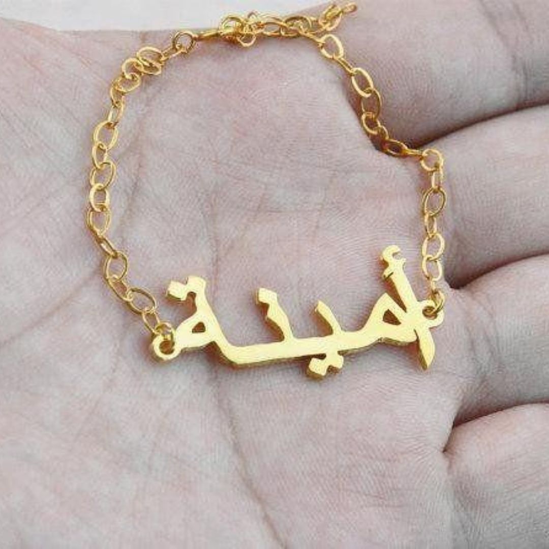 Personalized 'Amanda' name necklace in 18k gold-plated sterling silver, hanging from a delicate chain on a neutral background.