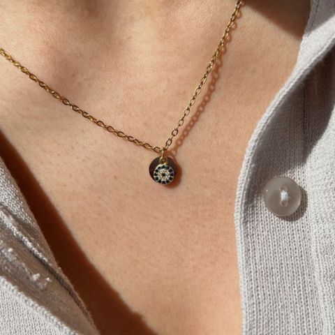 Personalized Evil Eye and Initial 'A' charm necklace in 18k gold-plated sterling silver, showing both charms on a delicate chain.