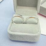 The Eternal Unity matching couple's rings set in sterling silver, showing both the wider and narrower bands side-by-side.