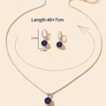 The Royal Sapphire Halo Jewelry Set in sterling silver, showing the matching necklace and earrings with their deep blue central stones and surrounding crystal halos.