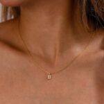 Dazzling pave initial 'M' necklace in 18k gold-plated sterling silver, sparkling on a delicate chain.