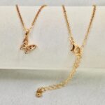 Graceful butterfly pendant necklace in 18k gold-plated sterling silver, showing the delicate charm on a fine chain.