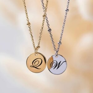 Dainty initial 'A' disc necklace with a satellite bead chain in 18k gold-plated sterling silver, shown against a neutral background.