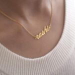 Regal Crown Name Necklace with the name 'Isabella' in 18k gold-plated sterling silver, showing the delicate crown on the first letter.