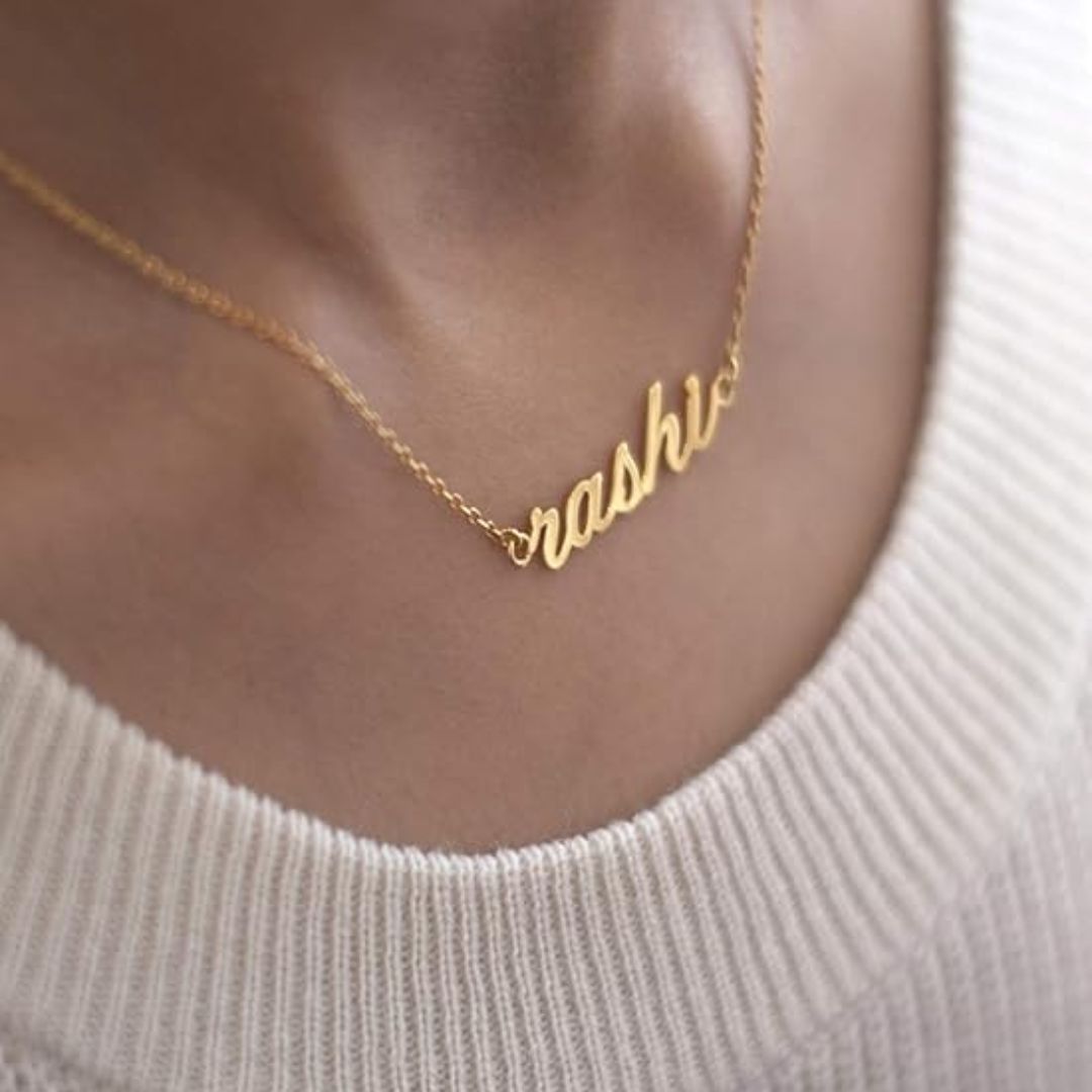 Regal Crown Name Necklace with the name 'Isabella' in 18k gold-plated sterling silver, showing the delicate crown on the first letter.