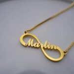 Personalized 'Emily' infinity name necklace in 18k gold-plated sterling silver, showing the name integrated into the timeless symbol.
