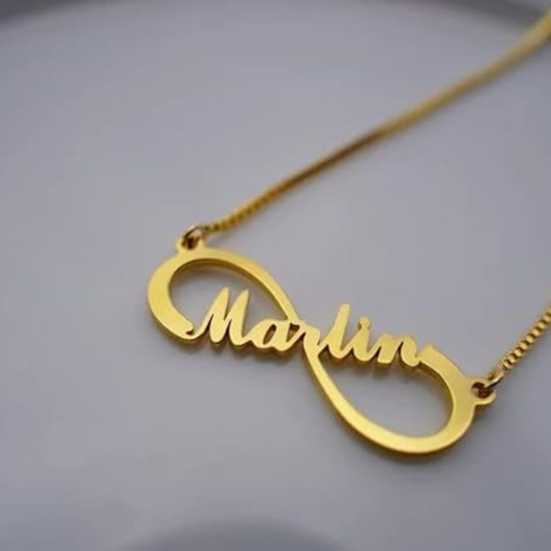Personalized 'Emily' infinity name necklace in 18k gold-plated sterling silver, showing the name integrated into the timeless symbol.