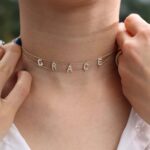 Gothic name choker with the name 'Aria' in Old English script, made from 18k gold-plated sterling silver.