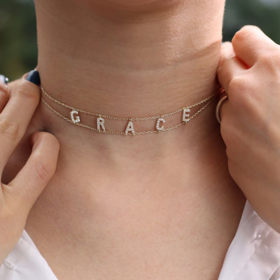 Gothic name choker with the name 'Aria' in Old English script, made from 18k gold-plated sterling silver.