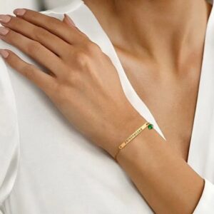 A personalized 'Chloe' bar bracelet in 18k gold-plated sterling silver, showing the engraved name and sparkling crystal accent.