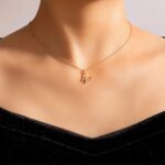 Graceful butterfly pendant necklace in 18k gold-plated sterling silver, showing the delicate charm on a fine chain.