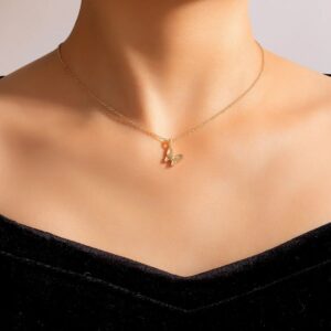 Graceful butterfly pendant necklace in 18k gold-plated sterling silver, showing the delicate charm on a fine chain.