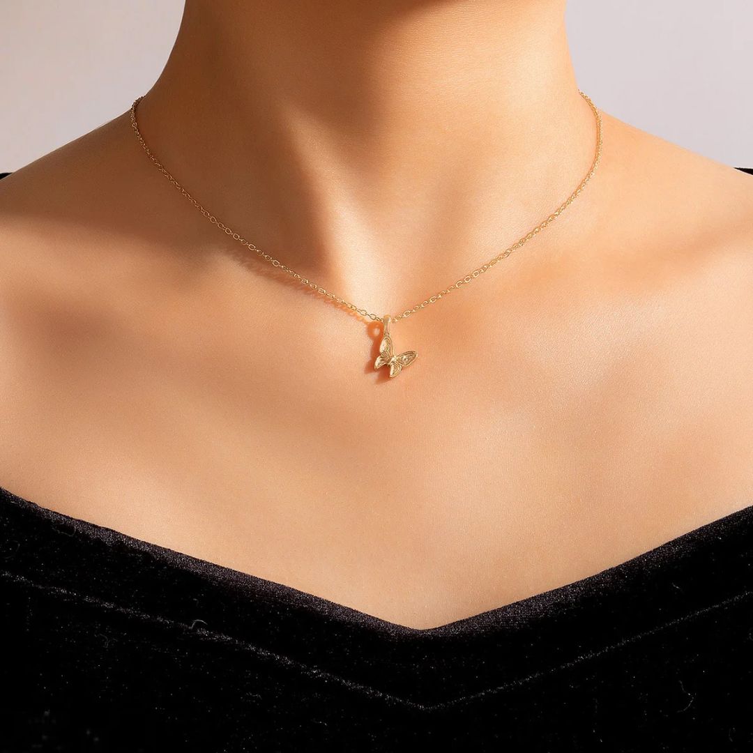 Graceful butterfly pendant necklace in 18k gold-plated sterling silver, showing the delicate charm on a fine chain.