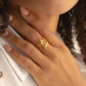 Personalized two-name ring in 18k rose gold-plated sterling silver, showing the names 'Noah' and 'Emma' on the open band design.