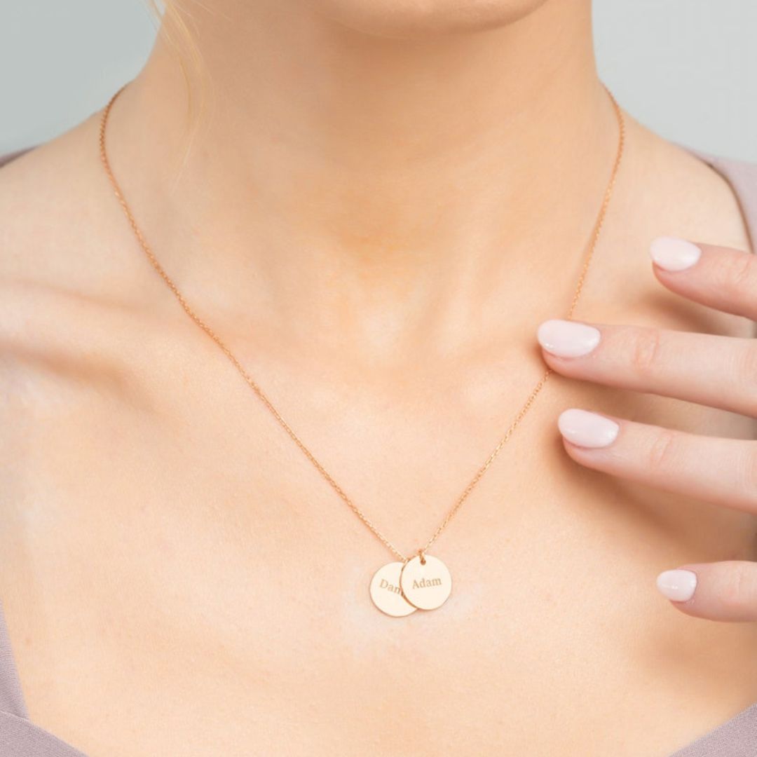 Personalized 'Jessica' oval frame name necklace in 18k rose gold-plated sterling silver, showing the pendant on a delicate chain.