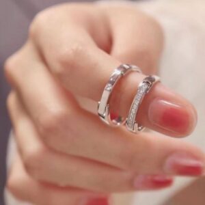 The Eternal Unity matching couple's rings set in sterling silver, showing both the wider and narrower bands side-by-side.