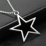 Celestial Hollow Star Necklace in antiqued sterling silver, showing the large, open-star pendant with its vintage-style oxidized finish.