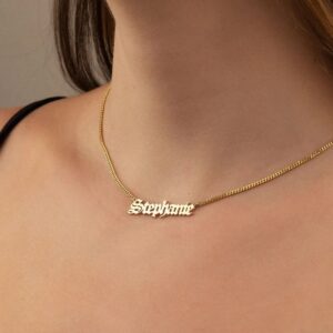 Gothic name necklace with the name 'Lilith' in Old English script, made from 18k rose gold-plated sterling silver on a curb chain.