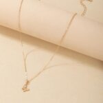 Graceful butterfly pendant necklace in 18k gold-plated sterling silver, showing the delicate charm on a fine chain.