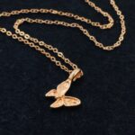 Graceful butterfly pendant necklace in 18k gold-plated sterling silver, showing the delicate charm on a fine chain.