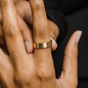 Ayatul Kursi ring in 18k gold-plated sterling silver, worn on a woman's finger to show the deeply engraved Arabic calligraphy of The Throne Verse.