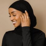 Ayatul Kursi ring in 18k gold-plated sterling silver, worn on a woman's finger to show the deeply engraved Arabic calligraphy of The Throne Verse.