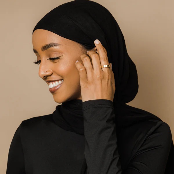 Ayatul Kursi ring in 18k gold-plated sterling silver, worn on a woman's finger to show the deeply engraved Arabic calligraphy of The Throne Verse.