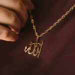 Allah calligraphy medallion necklace in 18k gold-plated sterling silver, showcasing the artistic script of "Allah" on the round pendant.