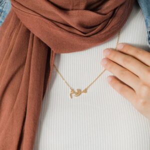 Ready-to-ship 'Fatima' Arabic name necklace in 18k gold-plated sterling silver, hanging on a delicate chain.