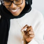 "I Am Near" Quranic verse bar necklace in 18k gold-plated sterling silver, showing the delicate Arabic calligraphy on the vertical pendant.