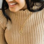 "I Am Near" Quranic verse bar necklace in 18k gold-plated sterling silver, showing the delicate Arabic calligraphy on the vertical pendant.