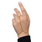A woman's hand wearing the Twisted Rope Hand Chain in 18k gold-plated sterling silver, showing the delicate rope chain draping over the hand.