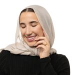 "With Hardship Comes Ease" engraved ring in 18k gold-plated sterling silver, worn on a finger to show the Arabic calligraphy band.