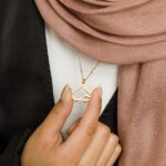 'Hubb' Arabic Love calligraphy heart necklace in 18k gold-plated sterling silver, showing the word for 'Love' forming the iconic heart shape.