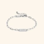 'Ukhti' Arabic calligraphy sister link bracelet in 18k gold-plated sterling silver, shown on a woman's wrist.