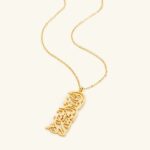 "With Hardship Comes Ease" medallion necklace in 18k gold-plated sterling silver, showcasing the intricate Arabic calligraphy engraving.